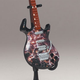 Illustration for article titled McFarlanes Tiny, Plastic Guitar Hero Guitars